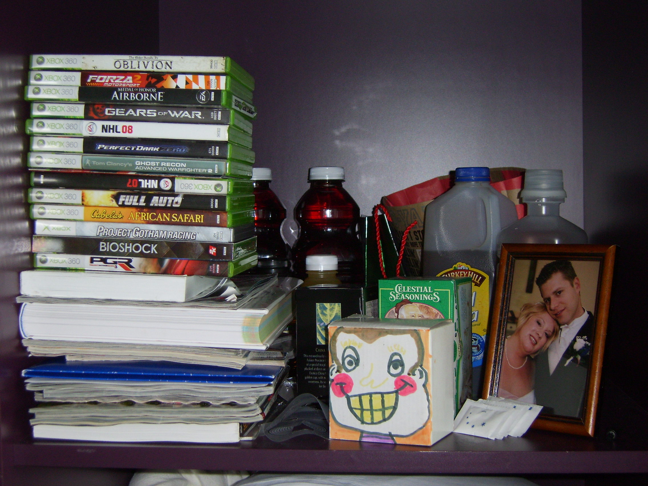 XBox games, books on EVERYTHING, the cute box that Butch's kids made for Kev (and donated their piggy bank to-so awesome!), our wedding picture..and behind lies the greatness.  Turkey Hill Tea and Juicy Juice Berry.  However, Kevin is losing his taste for JJ Berry due to the chemo ulcers-Hopefully it comes back because I've got 7 bottles of JJBerry in my trunk!
